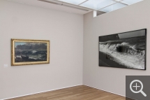 Partial view of "Les Territoires du désir" exhibition. Left, La Vague by Gustave Courbet; right, the wave photographed by Balthasar Burkhard. © MuMa Le Havre / Charles Maslard