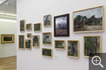 Partial view of "Les Territoires du désir" exhibition. The photograph Bugey Hills by Véronique Ellena is displayed alongside trees by Eugène Boudin. © MuMa Le Havre / Charles Maslard